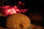 A wholemeal roll cooking in the oven